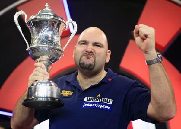 Scott Waites celebrates with the trophy during the BDO World Championship Final at the Lakeside Complex
