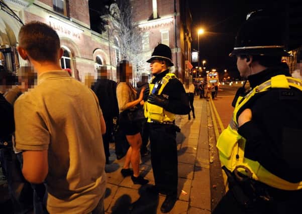 Police attend a late-night incident on the streets of Leeds. Library picture