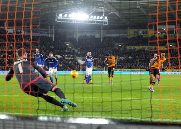 OPENING UP: Hull City's Abel Hernandez slots his first-half penalty past Cardiff goalkeeper David Marshall. Picture: Tony Johnson