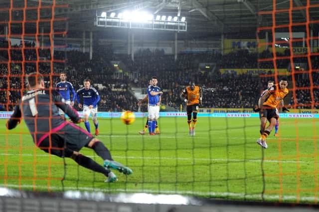 Hull City's Abel Hernandez slots his first-half penalty past Cardiff City goalkeeper David Marshall. Picture: Tony Johnson