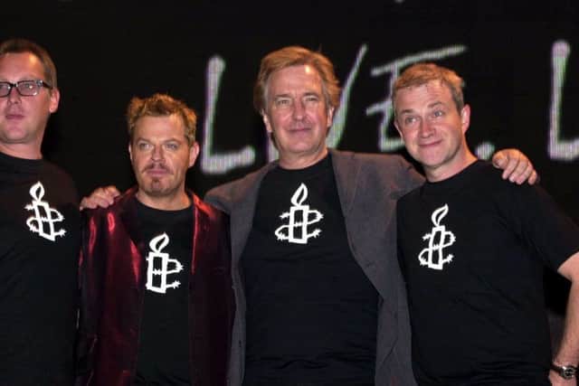 Comedians Vic Reeves and Eddie Izzard, with Alan Rickman and Harry Enfield during a photocall prior to the 'We Know Where You Live. Live!' event to mark the 40th anniversary of Amnesty International at London's Wembley Arena, in 2001