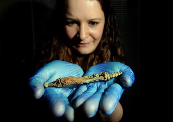 Dr Hannah Russ holds a Roman Miniature Sword found at Scotch Corner.
Picture by Simon Hulme