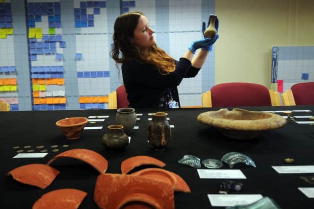 Dr Hannah Russ is pictured with some of the artifacts.
Picture by Simon Hulme