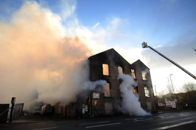 Firefighters put out the blaze at a mill on Grange Road, Batley. Picture by Simon Hulme