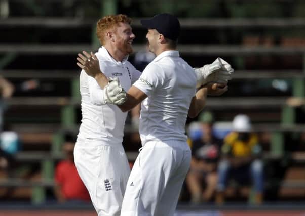 Yorkshire and Englands Jonny Bairstow, left, celebrates with team-mate Chris Woakes after running out South Africas batsman Temba Bavuma on day one of the third Test at Wanderers Stadium in Johannesburg (Picture: Themba Hadebe/AP).