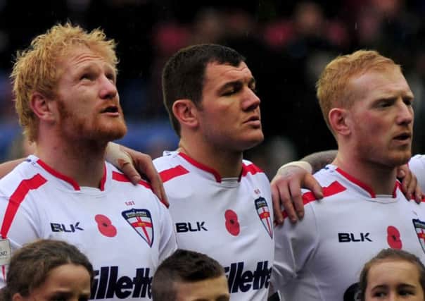 England rugby league players line up to sing God Save The Queen - but there are suggestions for a new anthem
