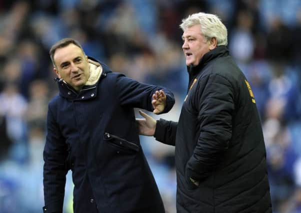 Sheffield Wednesday manager, Carlos Carvalhal and Championship rival, Steve Bruce, of Hull City.