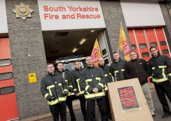 South Yorkshire Fire and Rescue members during a strike in 2014