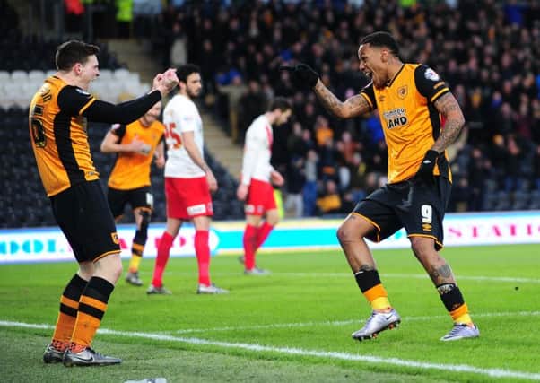 Hull's Abel Hernabdez celebrates his hat-trick with Andy Robertson.  Picture: Jonathan Gawthorpe