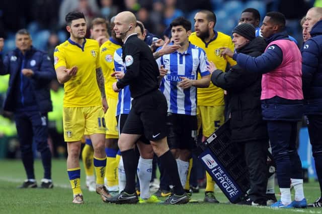 Referee Anthony Taylor is surrounded by Leeds players after the disallowed goal. (Picture: Simon Hulme)