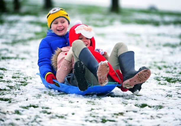 Children playing in the snow at Temple Newsam. Pictured Ewan and Cerys Thomas from Cross gates.
 (
Picture Jonathan Gawthorpe)