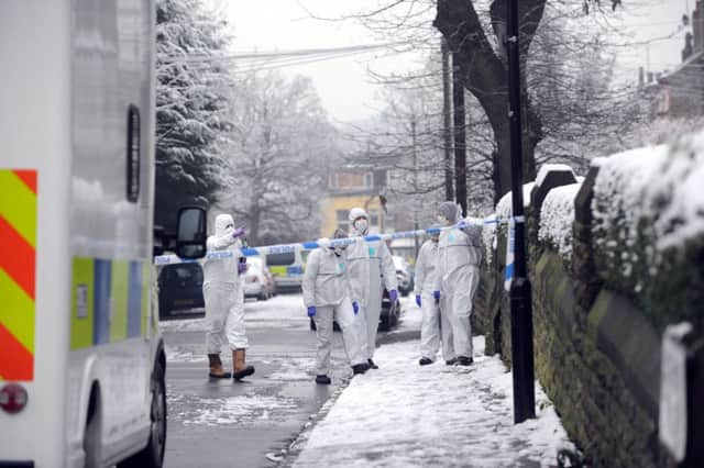 Police investigation officers at the scene where a body was found st St Augustine, Wrangthorp, Hyde Park, Leeds.