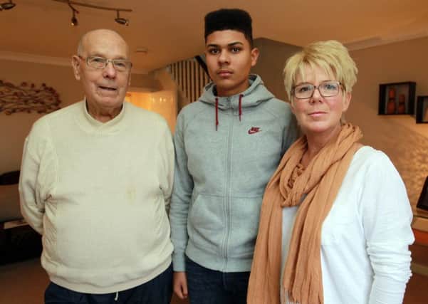 Footballer Luke Francis, now 16, who signed for SWFC academy at the age of 11, but only lasted a season, is now the subject of a very high compensation deal should he sign for any other club. Luke is pictured with his grandad Norman and mum Susan.