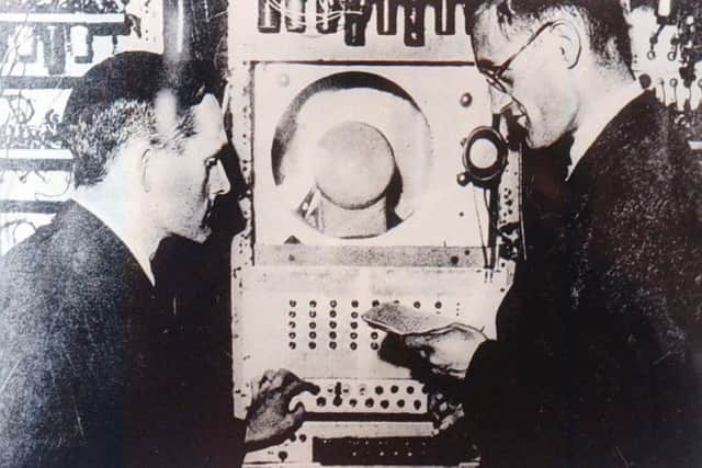 Professor Tom Kilburn (left) and  Professor Freddy Williams  with "Baby" - the worlds first "01"computer when they built it in 1948.  (Picture: Jeff Morris/PA)