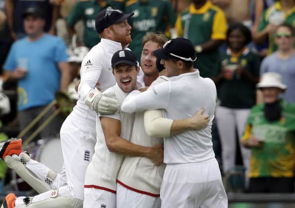 Englands players celebrate after taking the second wicket of South Africas batsman Stiaan van Zyl, on the third day's afternoon session in Johannesbur. Picture: AP/Themba Hadebe.