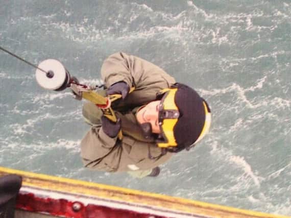 DWP photo taken from the Facebook account of Sandra Turnbull, showing her being winched out of an RAF Sea King helicopter. Photo : DWP/PA Wire