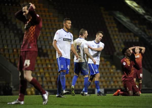 Devante Cole is brought to his knees in extra-time after a missed opportunity before Bradford City went out of the FA Cup in a penalty shoot-out with Bury (Picture: Bruce Rollinson).