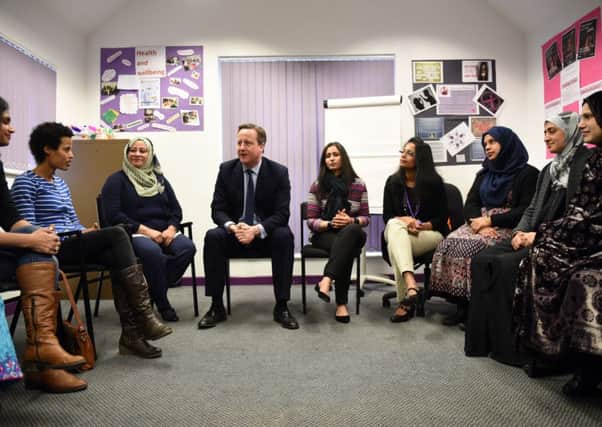 Prime Minister David Cameron meets women attending an English language class during a visit to the Shantona Women's Centre in Leeds. Photo: Oli Scarff/PA Wire