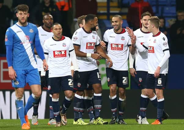 Bring on Leeds: Bolton's Darren Pratley, third from right, celebrates with team-mates after scoring his side's third and winning goal against Eastleigh.