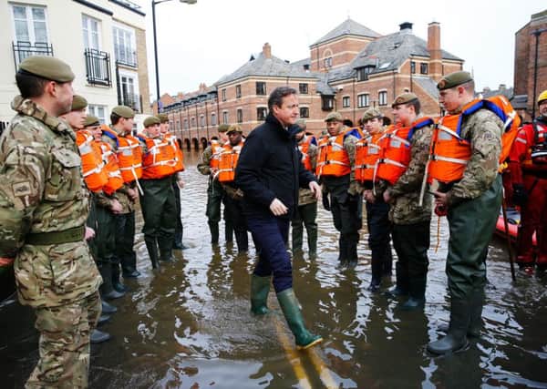 David Cameron meets soldiers in York who assisted with the city's flood relief effort. He was criticised for not meeting victims of the floods.