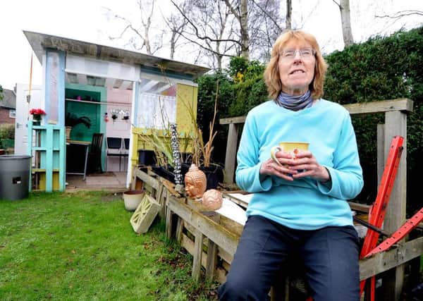 Ilona Richards, pictured in front of her Â£20 summerhouse, could be Britain's most frugal pensioner. (Picture James Hardisty)