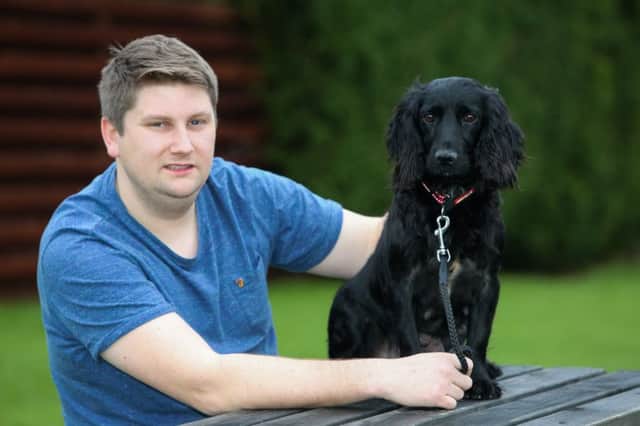 Matt Boyes from Whitby, reunited with his black spaniel, Bobby after two years. Picture: Ross Parry Agency