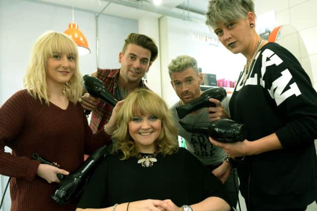 Sarah Cotton having her hair styled by some of her stylists at Bang