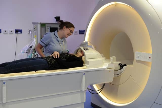 Radiologist Helen Browne gives a demonstration of 3T MRI machine with Ebony Taylor, 16, from Bentley in Doncaster who was the first patient to use the scanner at Sheffield Children's Hospital. Picture Bruce Rollinson