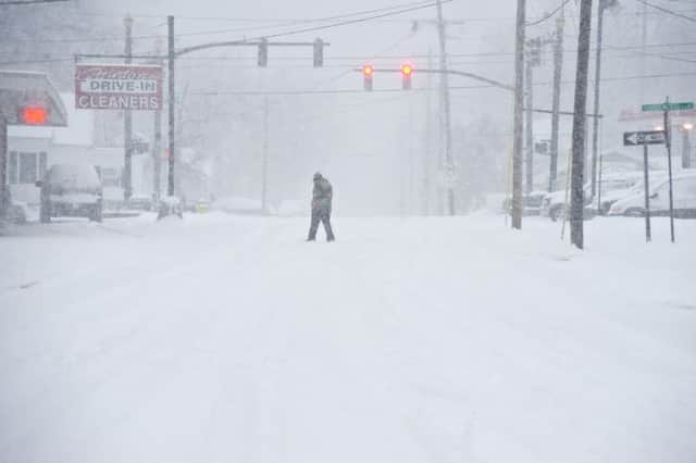 A person walks through the snow in Bowling Green, Kentucky