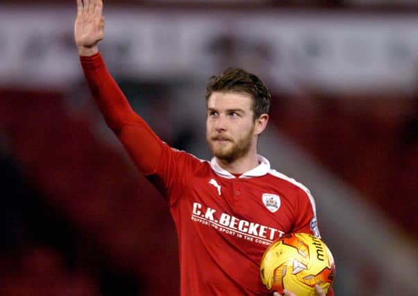 Hero: Barnsley Sam Winnall's with the match ball after his hat-trick against Rochdale. Picture James Hardisty.