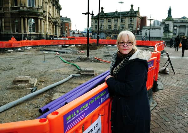 Queen Victoria Square in Hull being dug up for improvements for the city of Culture. Annie Bailey from Aspecs Opticians.
20th January 2016.
Picture : Jonathan Gawthorpe