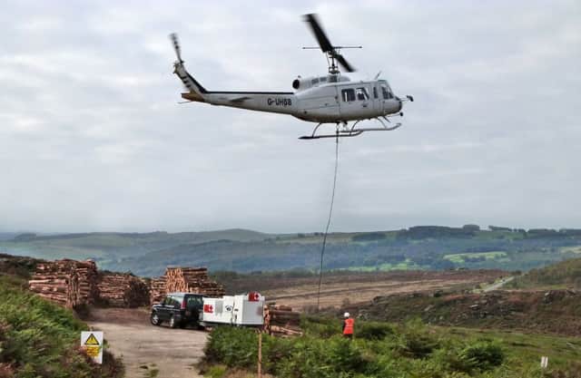 A helicopter removing trees from Burbage.