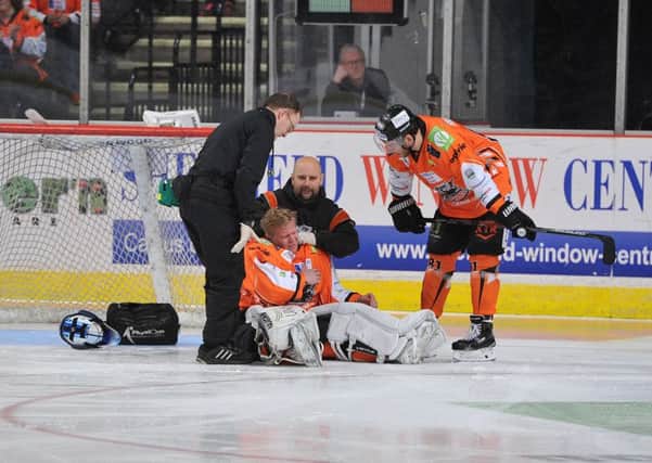 Sheffield Steelers' goaltender, Marek Pinc, receives treatment early in the second period before being forced to leave the ice. Picture: Dean Woolley.