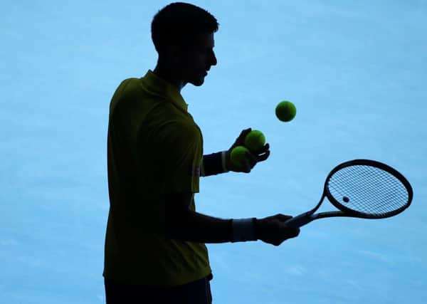 Novak Djokovic of Serbia prepares to serve to Gilles Simon of France during their fourth round match at the Australian Ope. Picture: AP Photo/Rick Rycroft.