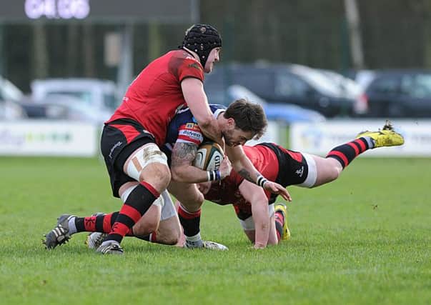 Doncaster Knights' Dougie Flockhart finds his path blocked by Jersey. Picture: Scott Merrylees