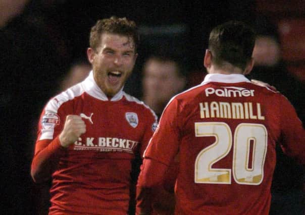 Barnsley's Sam Winnall celebrates after scoring the fifth goal of the match in front of fellow 'team of the week' selection Adam Hammill. Picture: James Hardisty