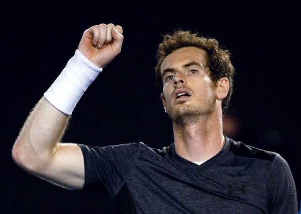 Andy Murray of Britain celebrates after defeating Bernard Tomic of Australia during their fourth round match in Melbourne on Monday. Picture: AP/Vincent Thian.
