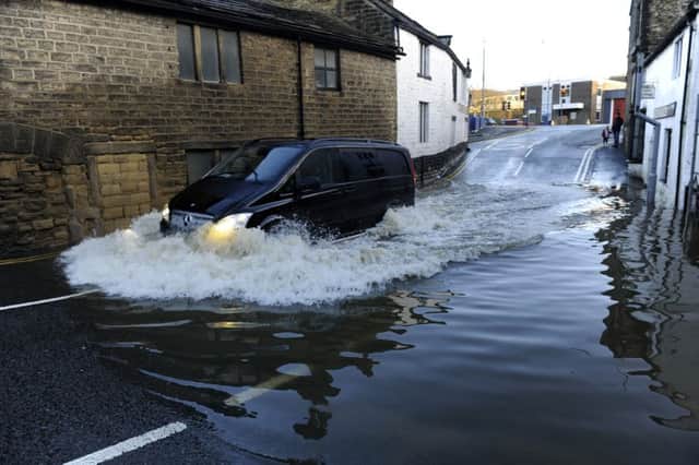 A van drives through water in Bingley on  27 December 2015 after flooding had hit the region