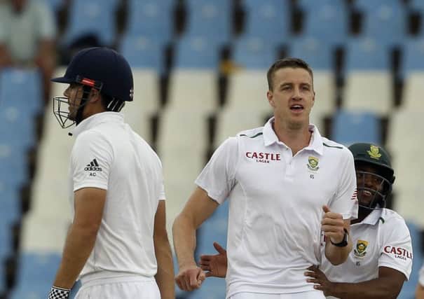 South Africas Morne Morkel celebrates after dismissing Englands captain Alastair Cook for five runs on the fourth day at Centurion. Picture: AP/Themba Hadebe.