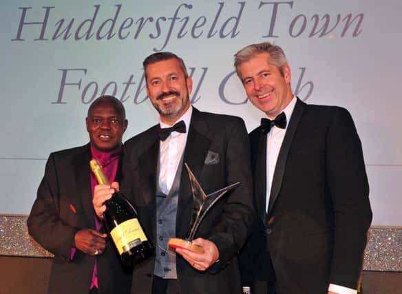 14 October 2015.......  Sean Jarvis, commercial director at Huddersfield Town receives  the Business Community award from Archbishop Dr John Sentamu and Justin Webb at the Yorkshire Post Excellence in Business awards at The Queens Hotel  in Leeds. The award recognised the work of the Town Foundation and its breakfast clubs.  Picture Tony Johnson