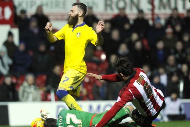 David Button and Harlee Dean combine to stop Mirco Antenucci.
(Picture: Bruce Rollinson)