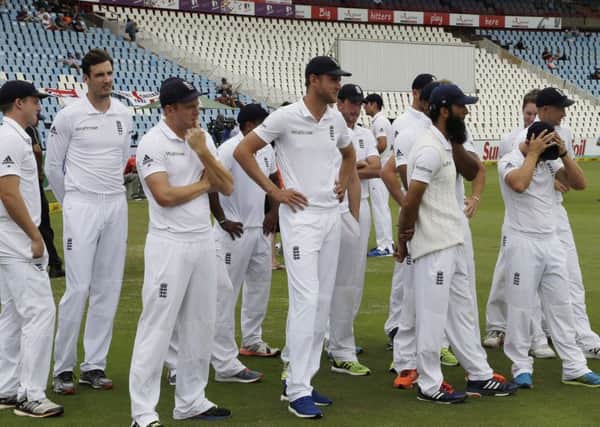 A dejected England cricket team at the end of the fifth day of the fourth Test cricket match againstSouth Africa.