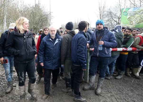 Jeremy Corbyn during a visit to a migrant camp in Calais. Policy continues to polarise public opinion.