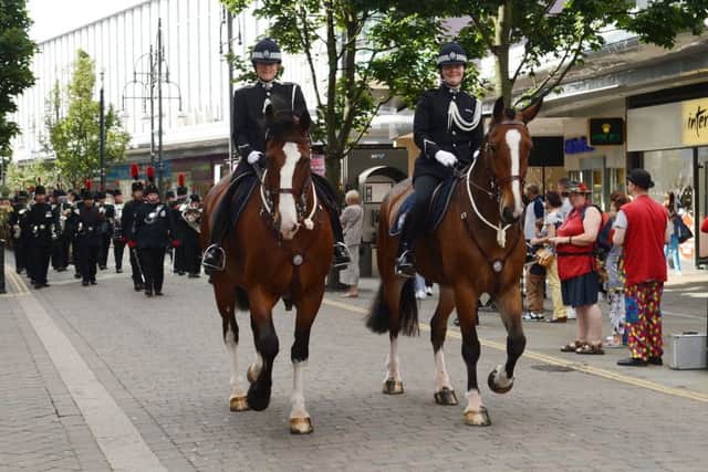 South Yorkshire Police mounted section take place in the Rifles Regiment parade. L-r are PC Alexandra Douglas, on Harley, and PC Ruth Dickins, on Hoober.  Picture: Liz Mockler D2405LM