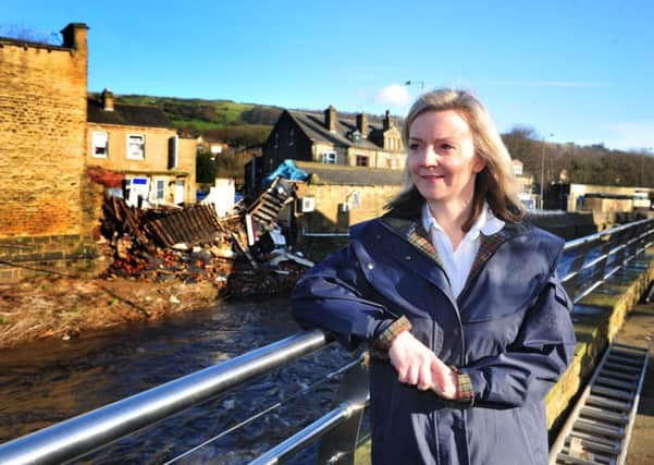 Environment Secretary Elizabeth Truss inspected flood damage during a visit to Mytholmroyd.  Picture Tony Johnson