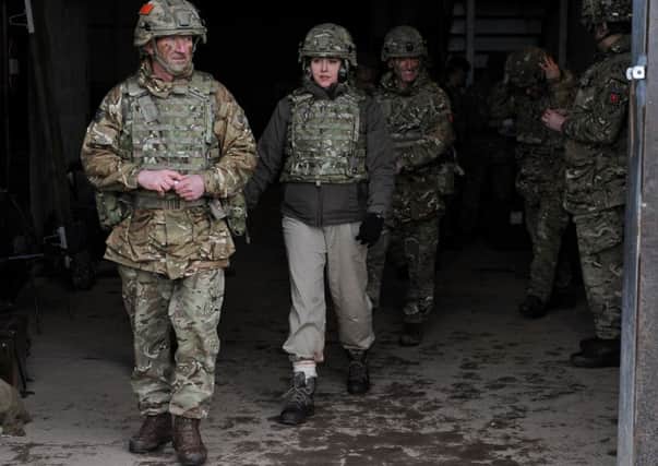 Armed Forces Minister Penny Mordaunt (second left) before watching a live firing exercise by members of the Infantry Battle School at the Sennybridge Training Area in the Brecon Beacons, Wales.  PRESS ASSOCIATION Photo. Picture date: Thursday January 28, 2016. See PA story POLITICS Army. Photo credit should read: Andrew Matthews/PA Wire