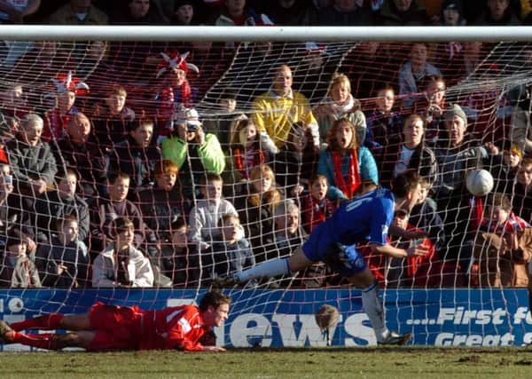 Chelsea's  John Terry  heads into an unguarded net to break the hearts of Scarborough players and supporters  and give Chelsea a 1-0 win in January 2004.