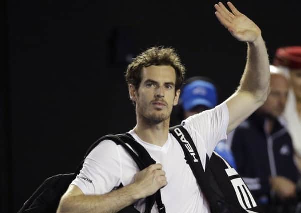 Andy Murray of Britain waves as he leaves Rod Laver Arena following his win over Milos Raonic of Canada in their semifinal match at the Australian Open. (AP Photo/Aaron Favila)