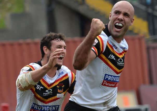 Bradford Bulls' Adrian Purtell (right) celebrates after scoring a try during the Super League Qualifier match at the Provident Stadium.