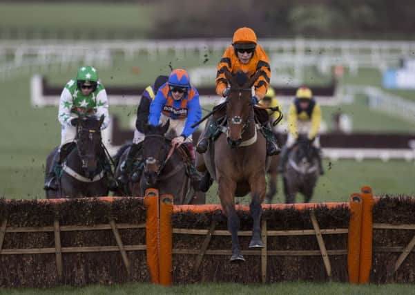 Thistlecrack ridden by Tom Scudamore leads the field over the last flight before going on to win The galliardhomes.com Cleeve Hurdle Hurdle Race during the Festival Trials Day at Cheltenham.